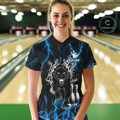 Woman wearing a blue flaming panther bowling quarter zip jersey during league competition front view.