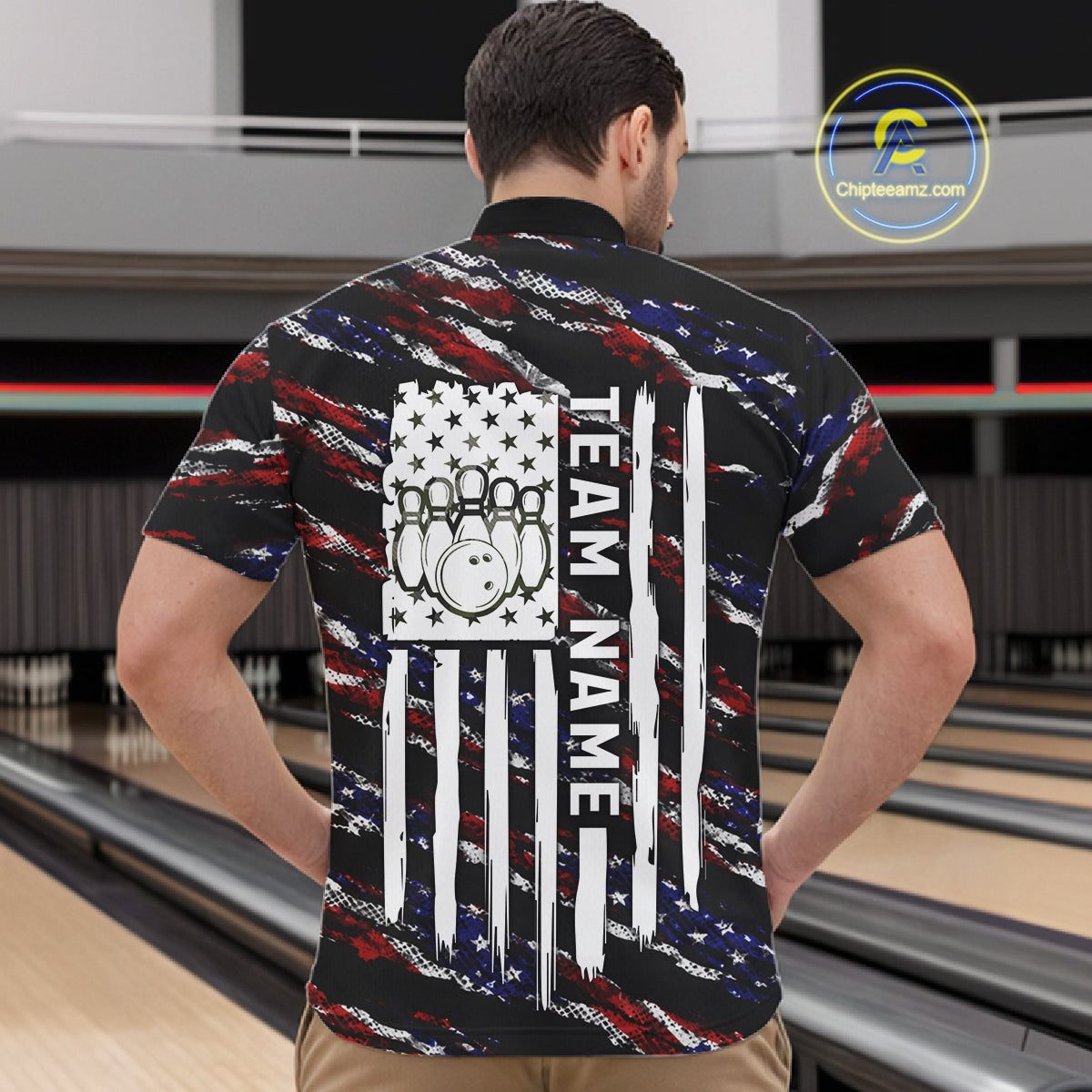 Back view of man wearing a black American flag quarter zip bowling shirt, bowling league team uniform.