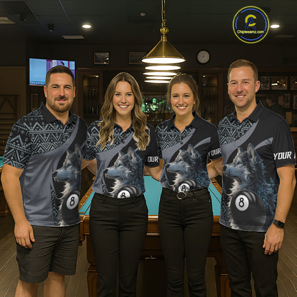 Four people wearing matching shirts with a wolf and 8 ball pool design in a bar setting.