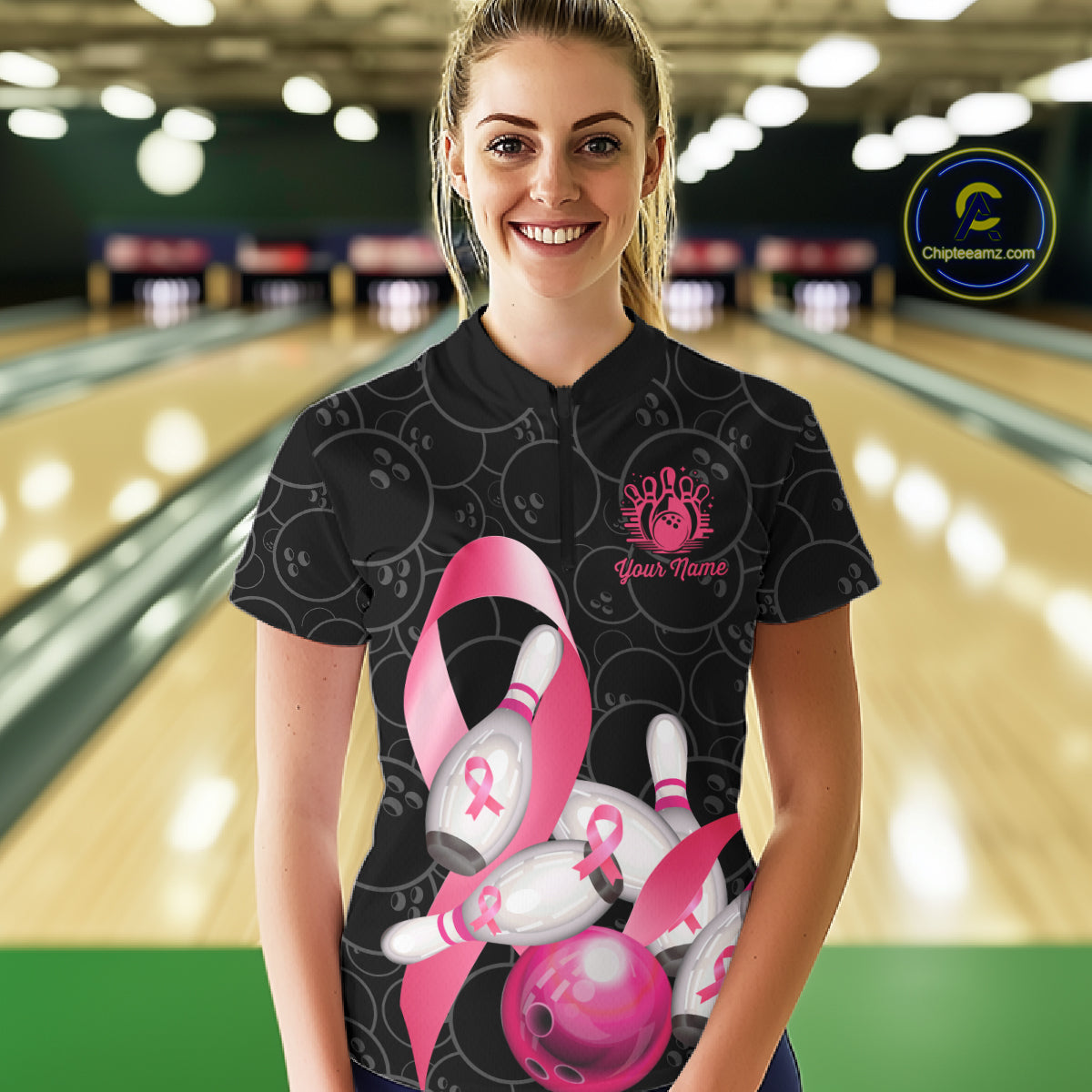Woman wearing pink ribbon breast cancer awareness bowling team jersey quarter zip shirt featuring pink ribbon artwork, front view.