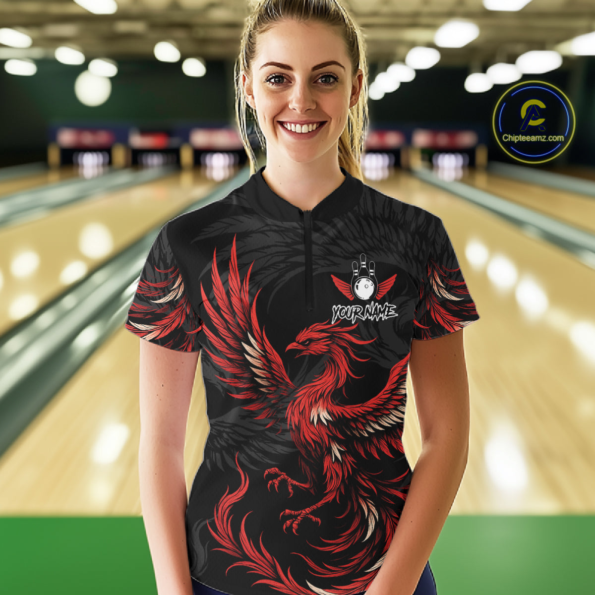 Woman wearing black and red phoenix wings bowling quarter zip shirt front view.