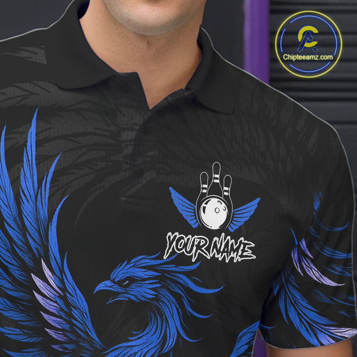 Close up of black and blue phoenix wings bowling polo shirt collar, buttons and chest design.