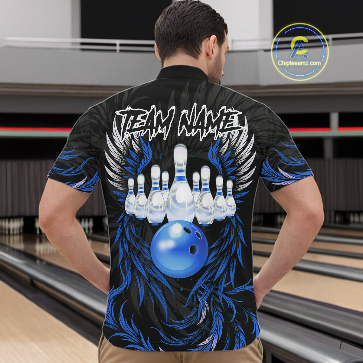 Man wearing black and blue phoenix wings bowling quarter zip shirt back view.
