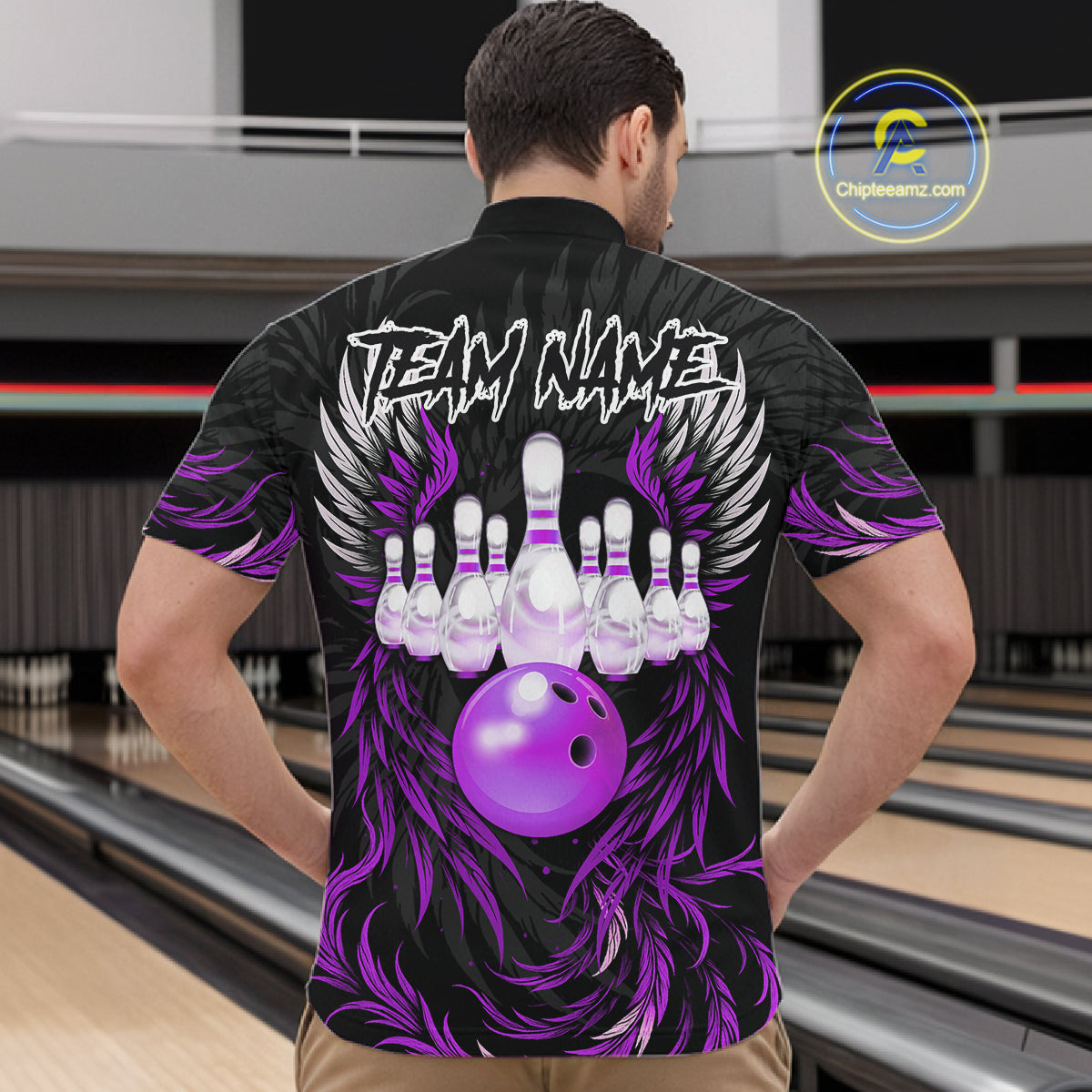 Man wearing black and purple phoenix wings bowling quarter zip shirt back view.