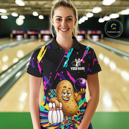 Woman wearing a colorful potato bowling polo shirt at a bowling alley front view.