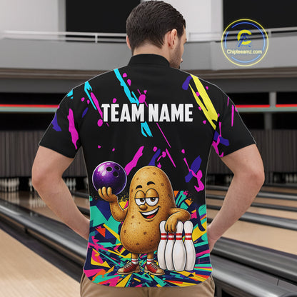 Back view of man wearing a colorful potato bowling quarter zip shirt in a bowling alley.