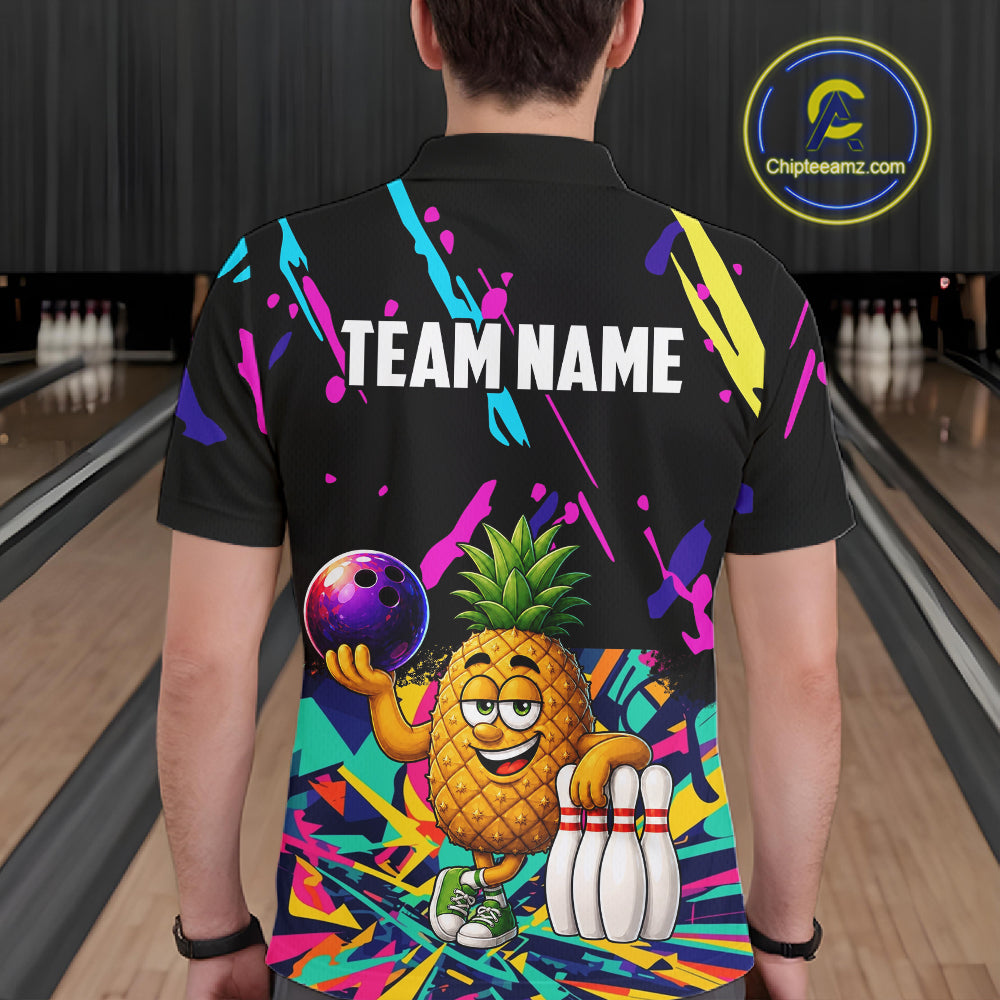 Back view of man wearing a colorful pineapple bowling polo shirt inside a bowling alley.