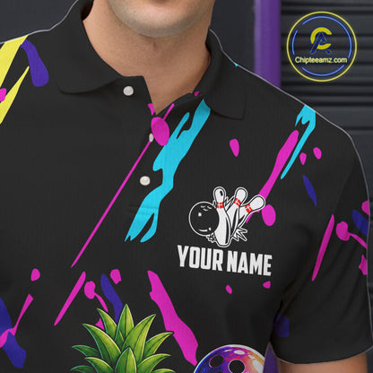 Close-up of a colorful pineapple bowling polo shirt collar, buttons, and pineapple artwork.