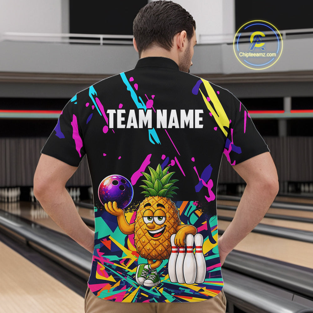 Back view of man wearing a colorful pineapple bowling quarter zip shirt in a bowling alley.