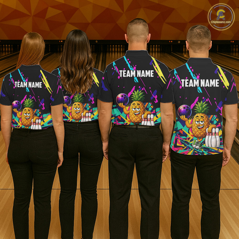 Back view of bowling team wearing matching pineapple bowling shirts in a bowling alley.