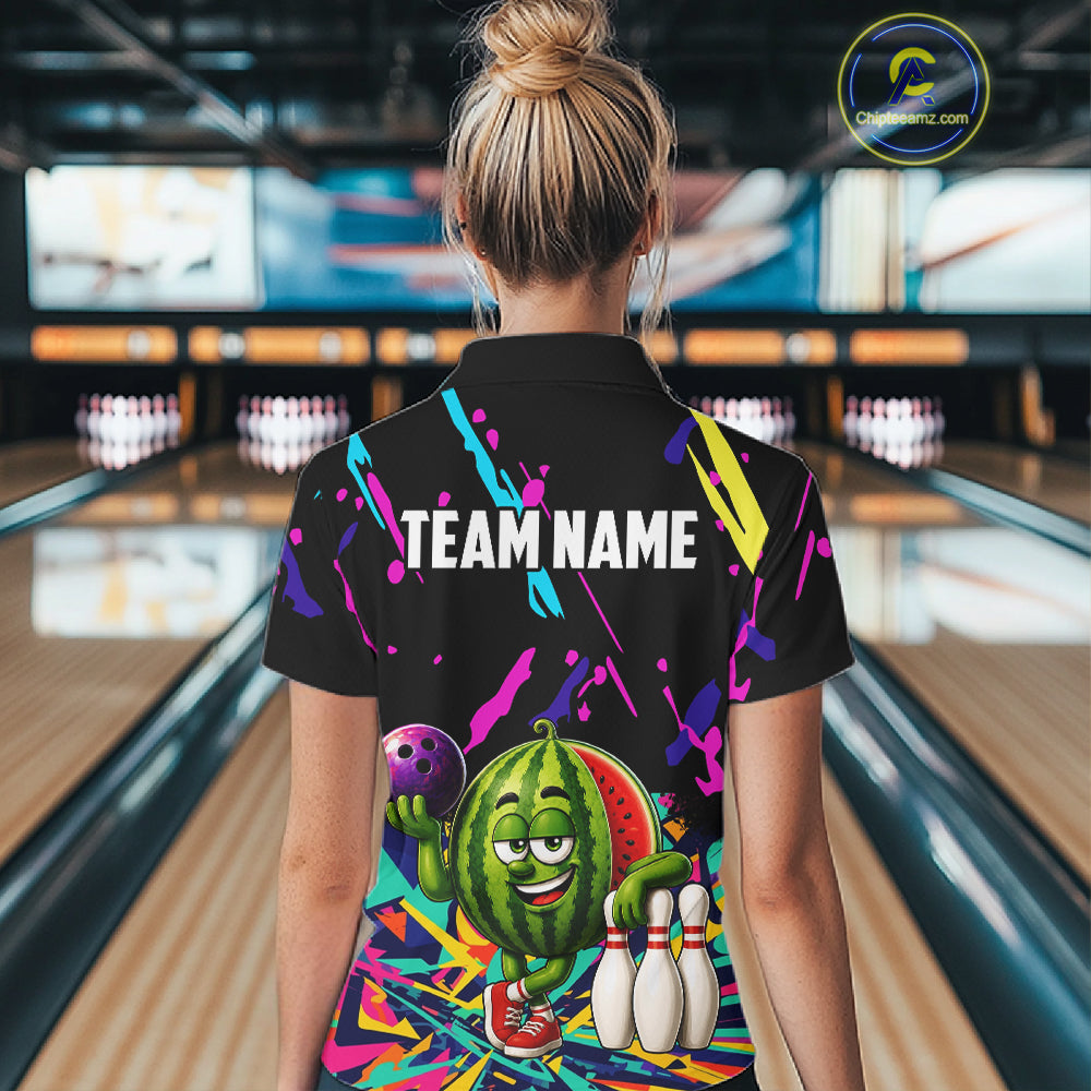 Back view of woman wearing a colorful watermelon bowling polo shirt inside a bowling alley.