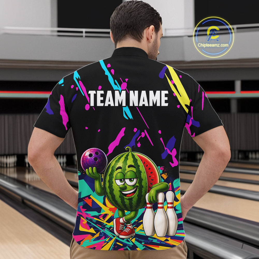 Back view of man wearing a colorful watermelon bowling quarter zip shirt in a bowling alley.