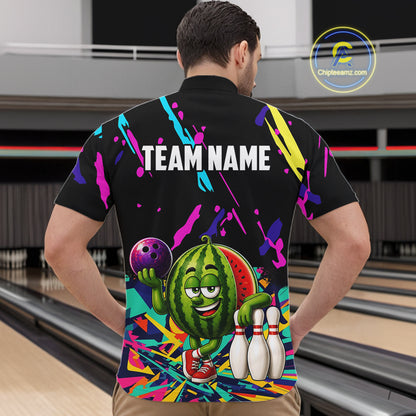 Back view of man wearing a colorful watermelon bowling quarter zip shirt in a bowling alley.