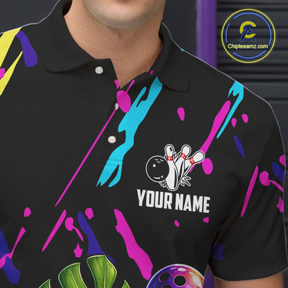 Close-up of a colorful monstera hibiscus bowling polo shirt collar, buttons, and tropical artwork.