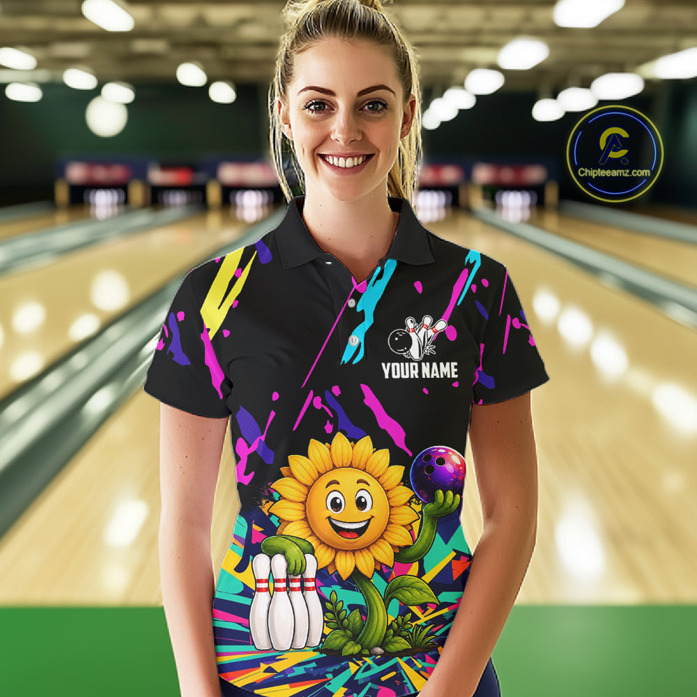 Woman wearing a colorful sunflower bowling polo shirt at a bowling alley front view.