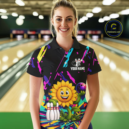 Woman wearing a colorful sunflower bowling polo shirt at a bowling alley front view.