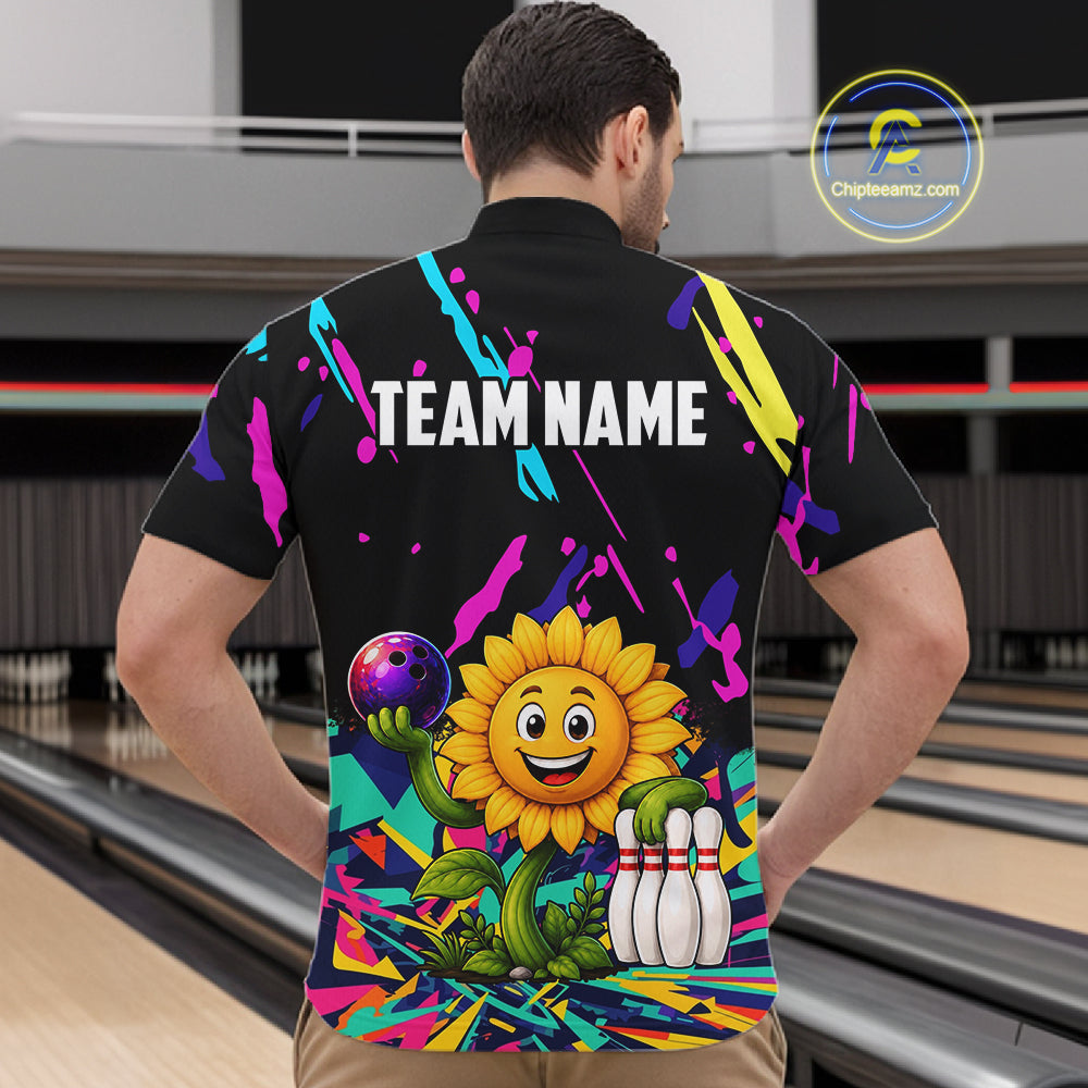 Back view of man wearing a colorful sunflower bowling quarter zip shirt in a bowling alley.