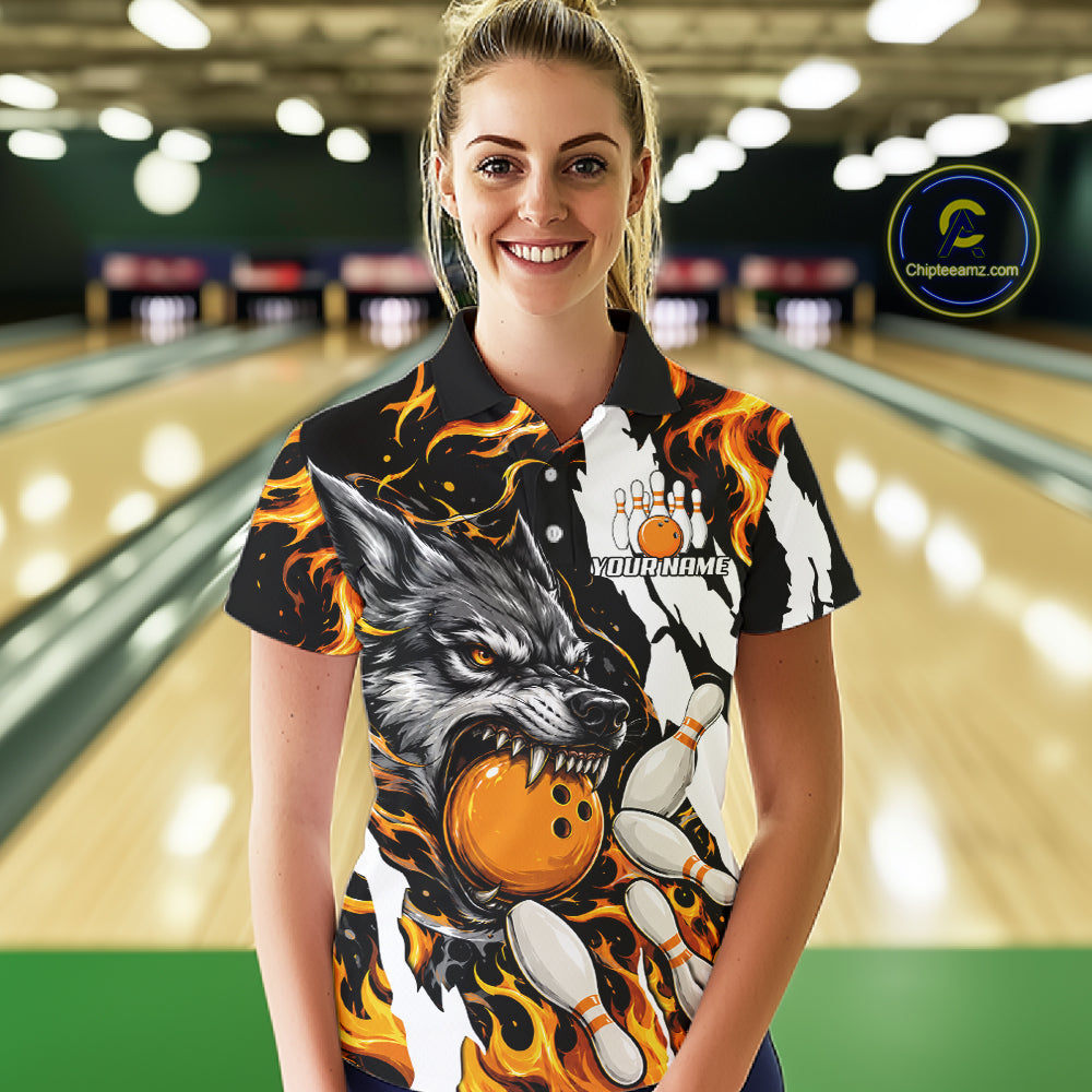 Woman wearing personalized orange flame wolf bowling team jersey polo shirt featuring orange flame wolf artwork, front view.