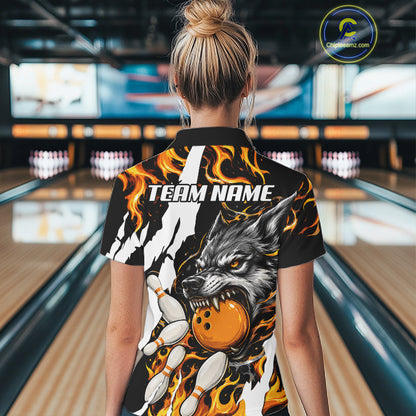 Woman wearing personalized orange flame wolf bowling team jersey quarter zip shirt featuring orange flame wolf artwork, front view.
