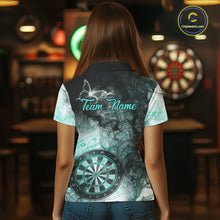 Load image into Gallery viewer, Back view of woman wearing a turquoise butterfly smoke darts shirt.