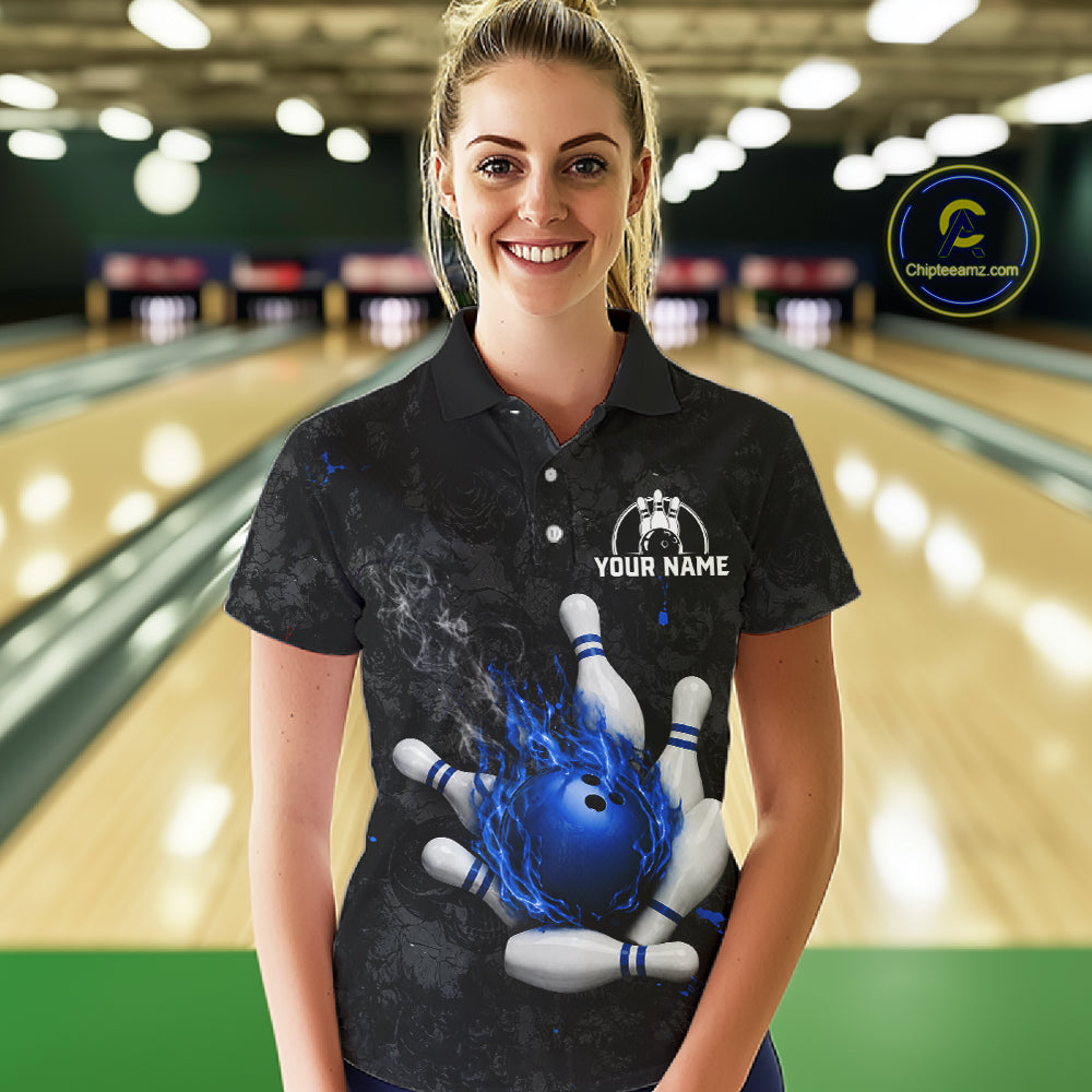 Woman wearing black and blue grunge fire bowling polo shirt front view.