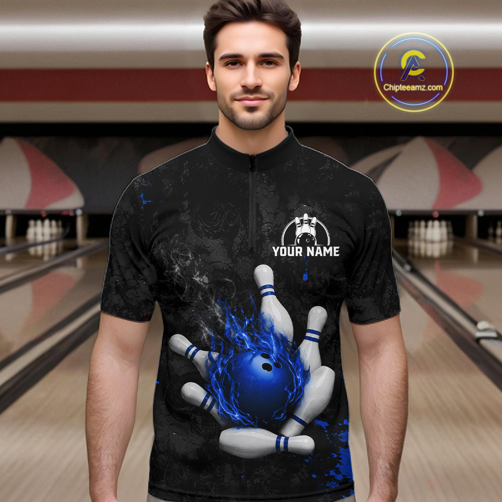Man wearing black and blue grunge fire bowling quarter zip shirt front view.