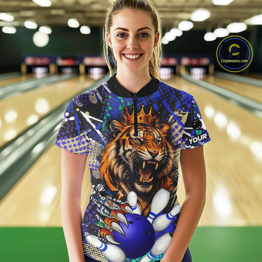 Woman wearing blue graffiti tiger bowling quarter zip shirt front view.
