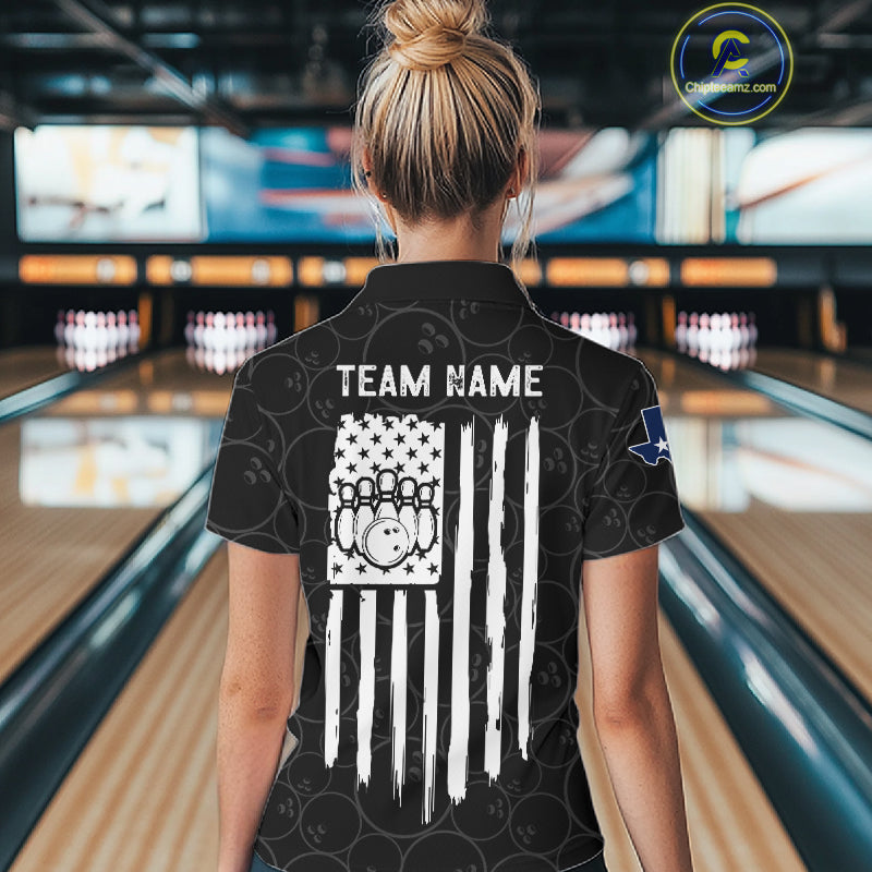 Back view of woman wearing a US flag Texas bowling polo shirt inside a bowling alley.