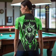 Load image into Gallery viewer, Woman wearing black and green 8 ball pool icy billiard team jersey polo shirt featuring the frozen 8 ball artwork, back view.