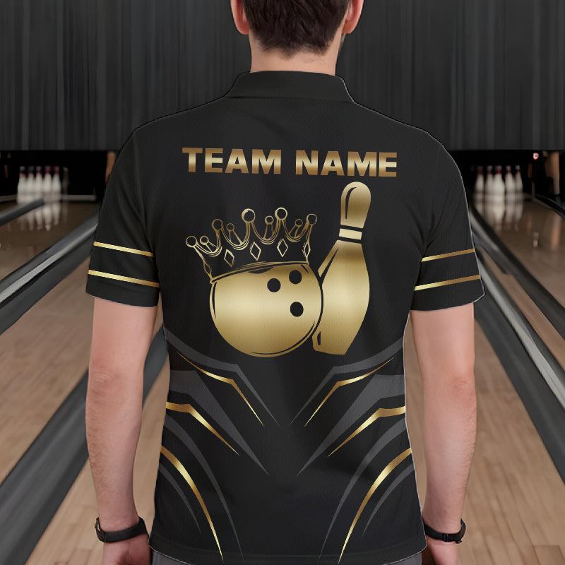 Back view of man wearing a black and gold crown bowling ball polo shirt inside a bowling alley.