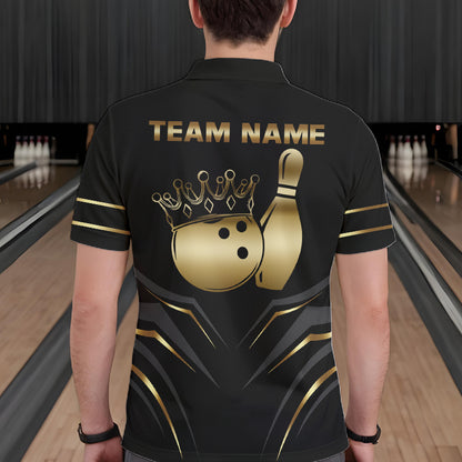 Back view of man wearing a black and gold crown bowling ball polo shirt inside a bowling alley.