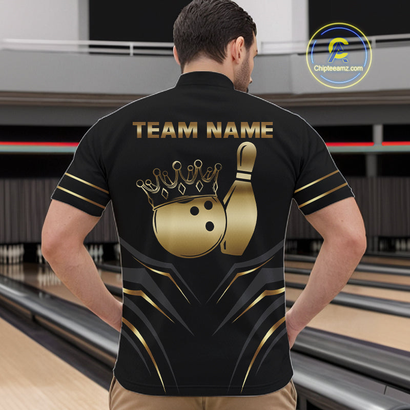 Back view of man wearing a black and gold crown bowling ball quarter zip shirt in a bowling alley.