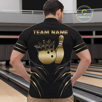Back view of man wearing a black and gold crown bowling ball quarter zip shirt in a bowling alley.