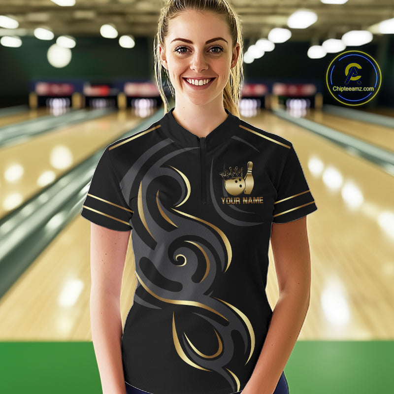 Woman wearing a black and gold crown bowling ball quarter zip jersey during league competition front view.