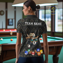 Load image into Gallery viewer, Back view of woman wearing an 8 ball tribal pattern pool shirt in a billiards hall.