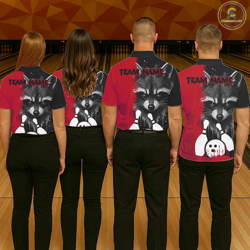 Back view of bowling team wearing matching black and red raccoon bowling shirts in a bowling alley.