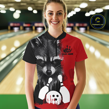 Woman wearing a black and red raccoon bowling quarter zip jersey during league competition front view.