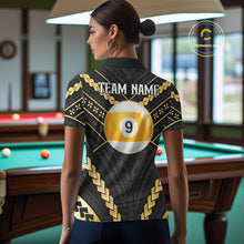 Load image into Gallery viewer, Back view of woman wearing a black and gold 9 ball tribal pool shirt in a billiards hall.