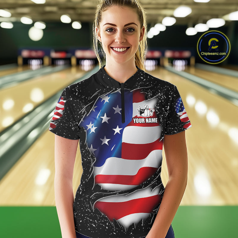 Woman wearing a black grunge American flag quarter zip bowling shirt front view, personalized bowling team apparel.
