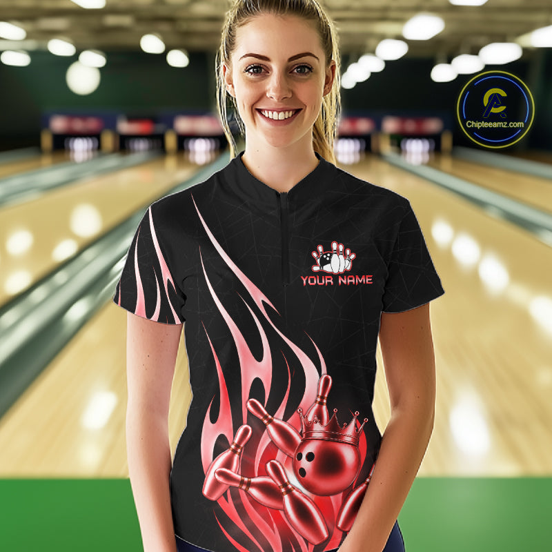 Woman wearing a black and red bowling ball crown quarter zip bowling shirt front view.