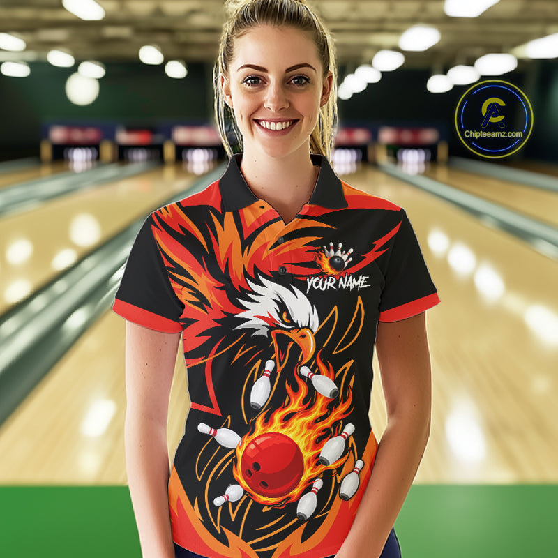 Woman wearing black and orange flame eagle bowling polo shirt front view.