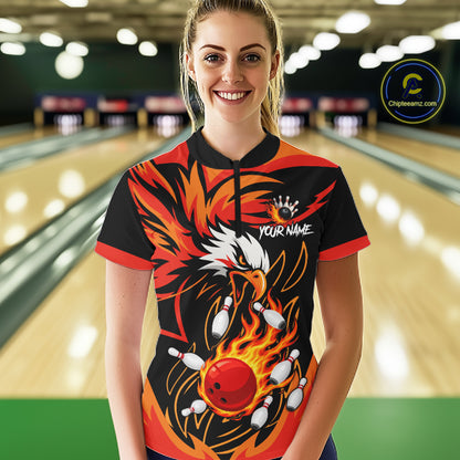Woman wearing black and orange flame eagle bowling quarter zip shirt front view.