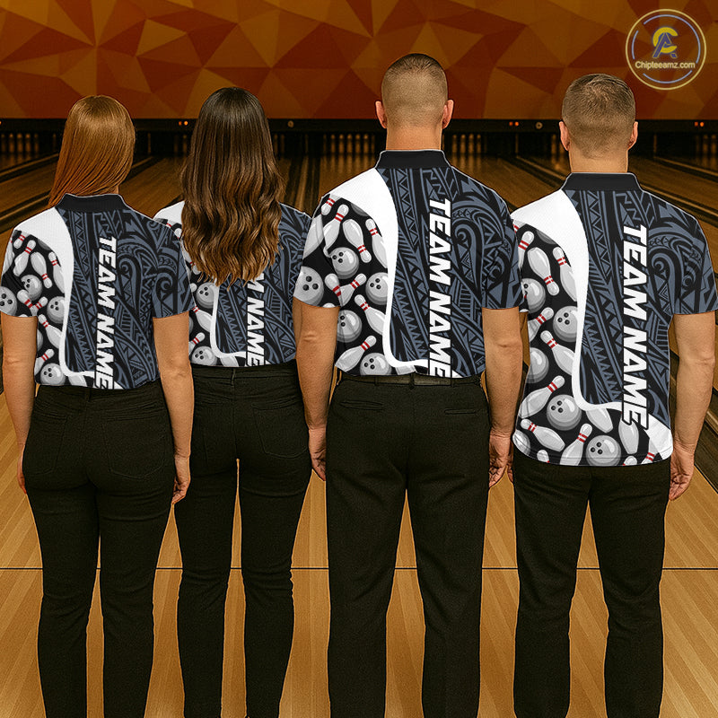 Back view of bowling team wearing matching blue tribal bowling shirts in a bowling alley.