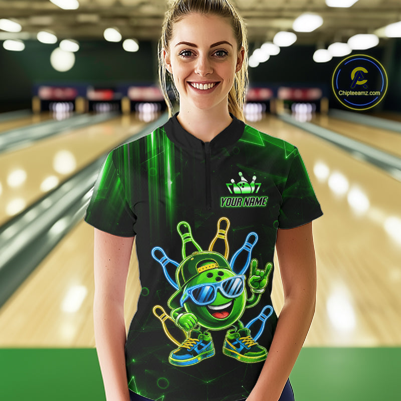 Woman wearing a green funny neon bowling ball quarter zip bowling shirt front view.