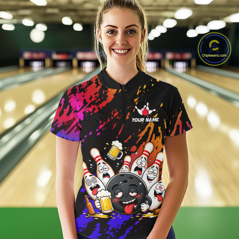 Woman wearing blue and red drunk bowling balls and pins bowling quarter zip shirt front view.