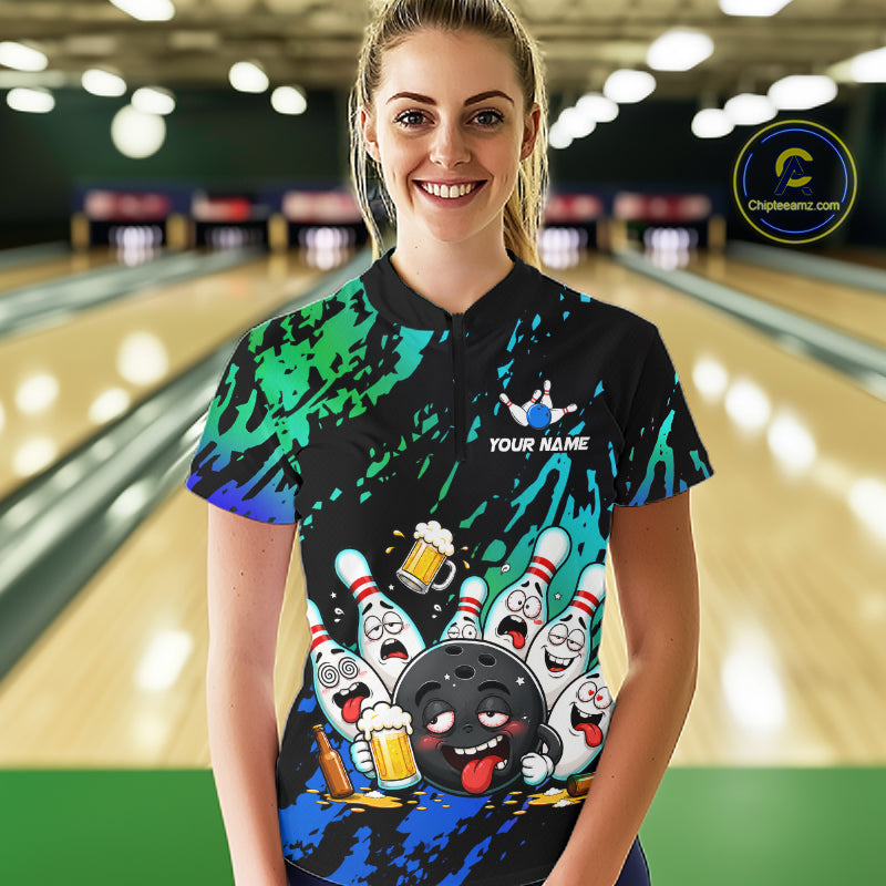 Woman wearing blue and turquoise drunk bowling balls bowling quarter zip shirt front view.