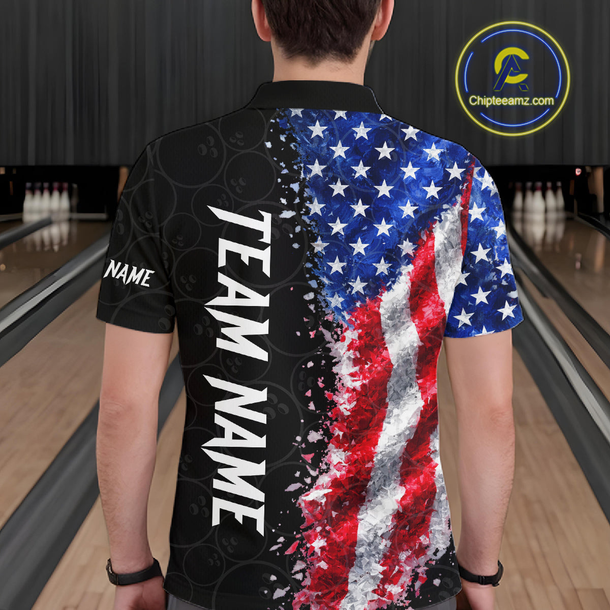 Back view of man wearing an American flag bowling polo shirt inside a bowling alley.