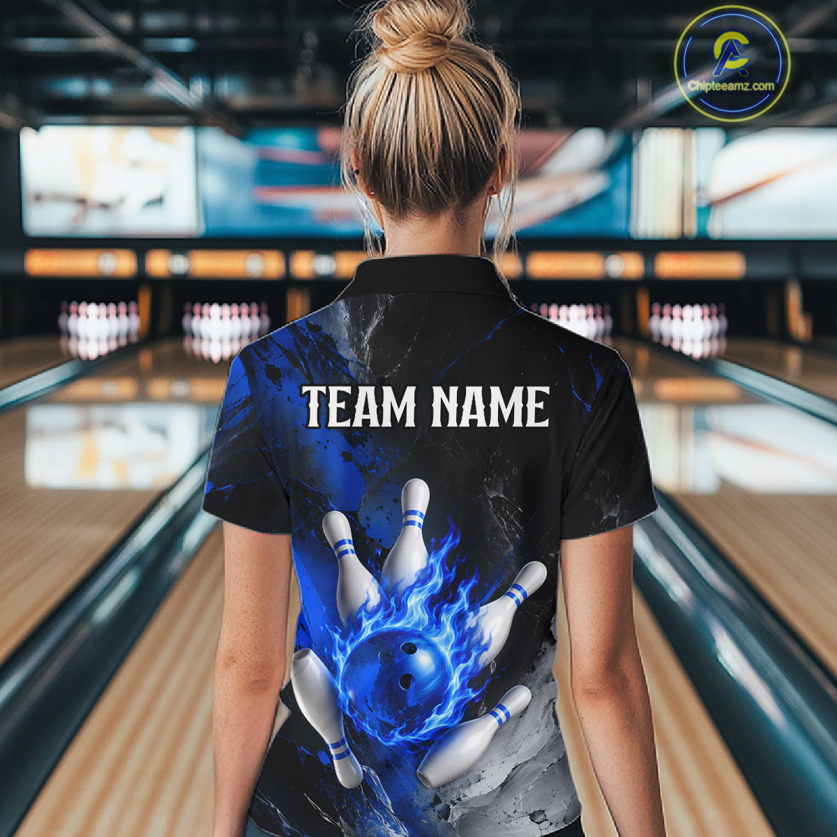 Woman wearing black and blue flaming bowling quarter zip shirt front view.