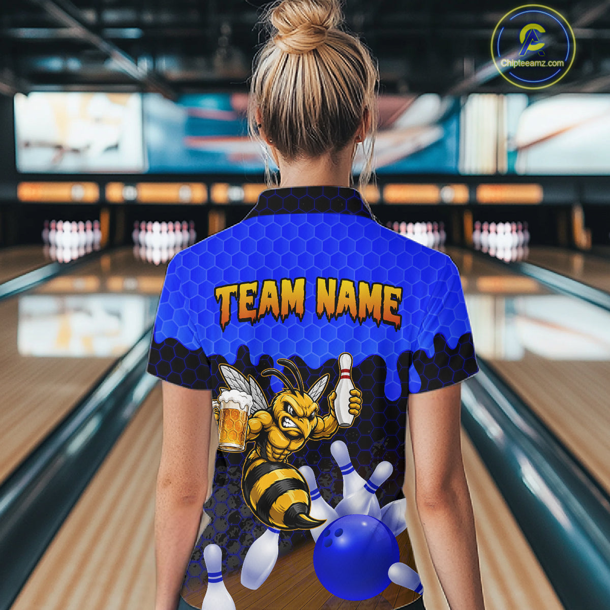 Female model wearing the Black and Blue Funny Bee Beer Bowling polo shirt featuring blue hexagon bowling graphics, back view