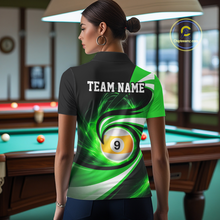 Load image into Gallery viewer, Woman wearing black and green 8 ball and 9 ball pool billiard team jersey polo shirt featuring bold black and green graphics, back view.